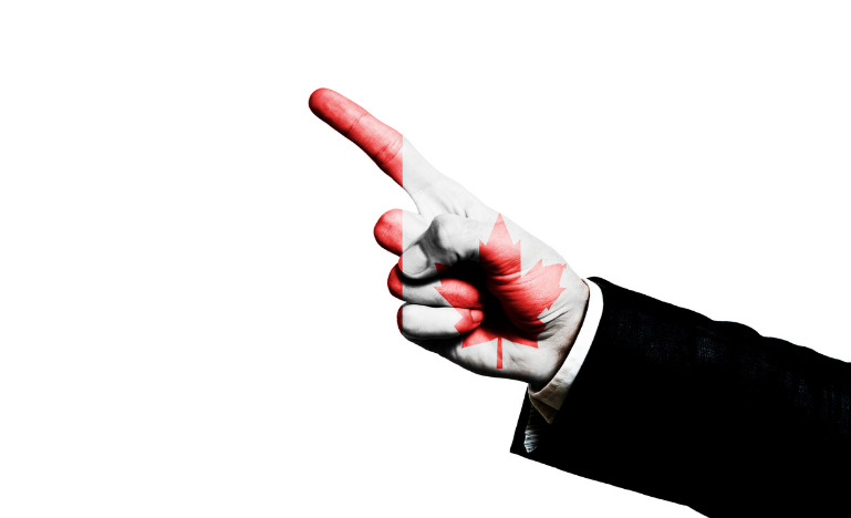 Finger with Canada imprint pointing away
