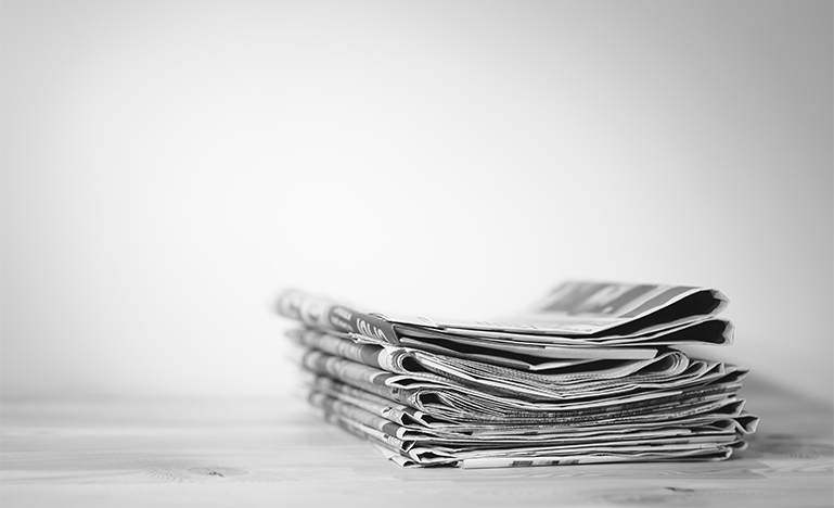 Newspaper on wooden table