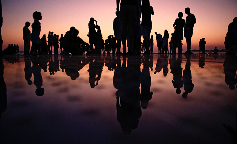 Silhouette of people standing on mirror to illustrate lack of data about articling students
