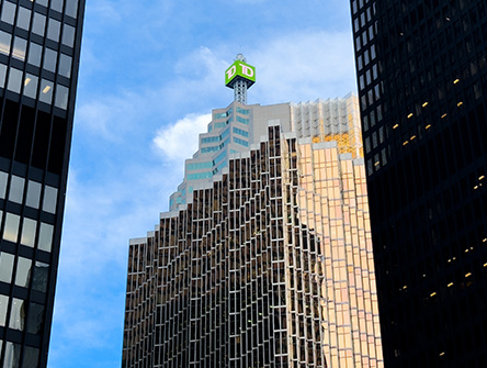 A TD Canada Trust sign seen atop, from street level on the TD Canada Trust Tower