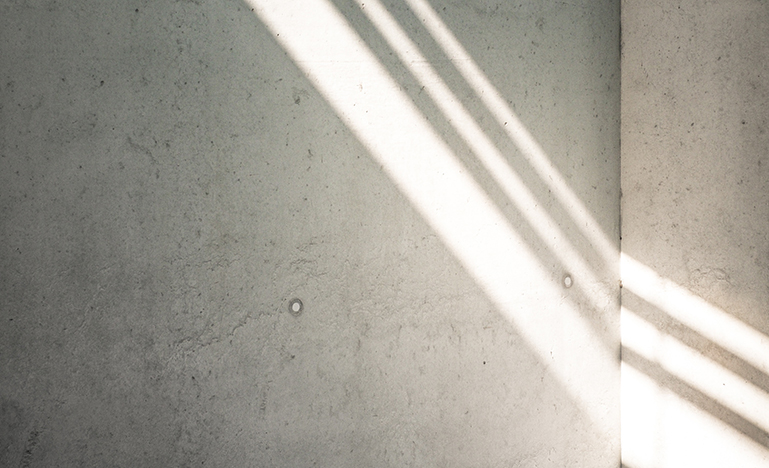 Light beams reflecting on concrete