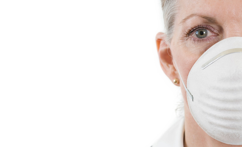 Women wearing white mask staring