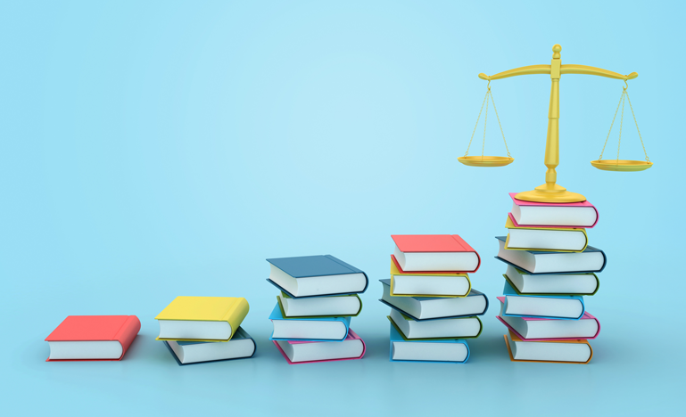 Scale on top of a pile of books