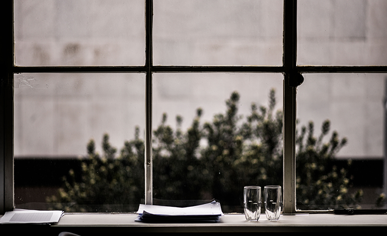 Image of papers on a table in front of a window