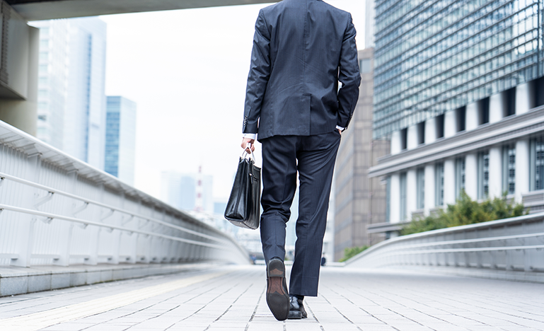 business man walking away