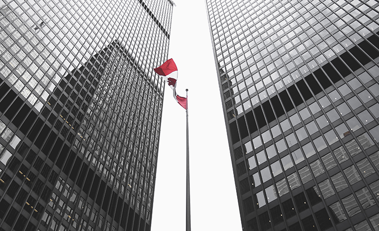 View of office buildings and Canadian Flag