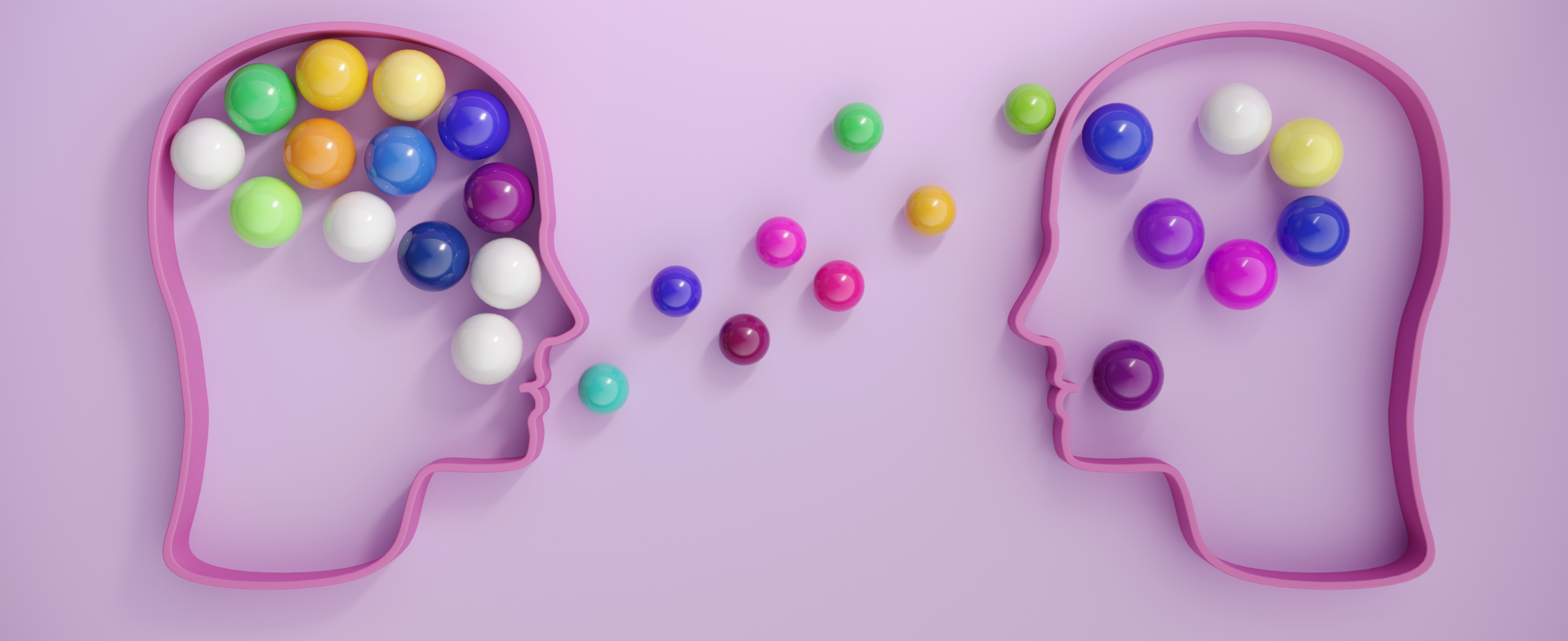 Human heads connected by multi-coloured spheres, symbolizing mentorship