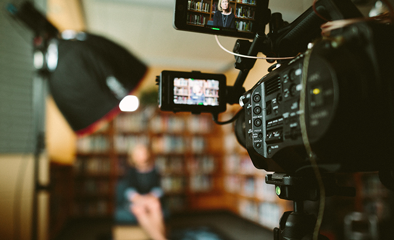 woman in front of camera