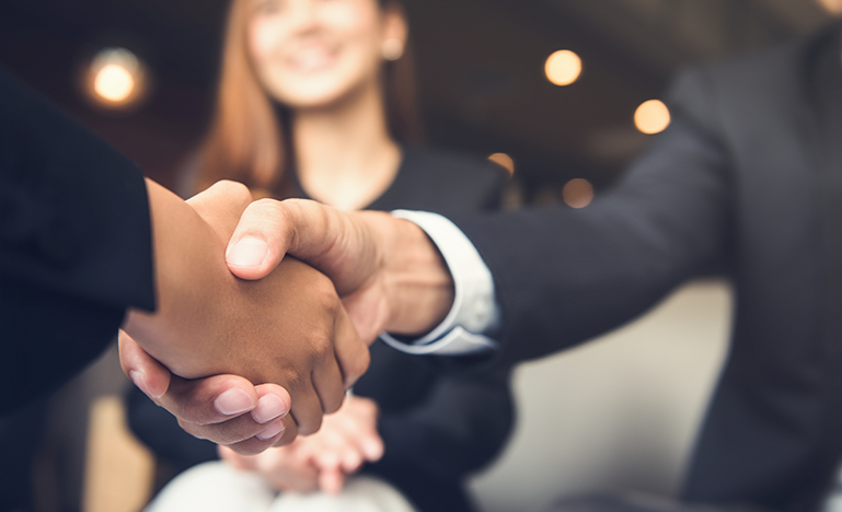 Business people shaking hands during an event