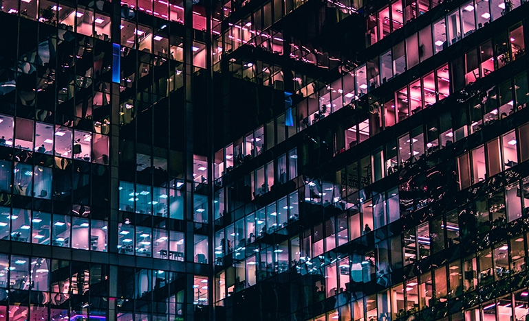 Colourful lights inside an office building at night