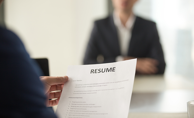 Person holding a resume