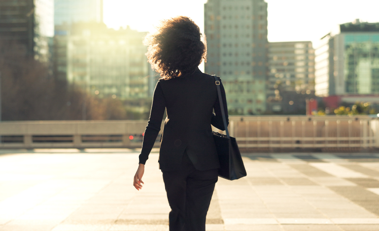 A woman leaves a downtown law firm