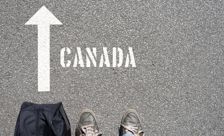 A man with a travel bag on his way to Canada