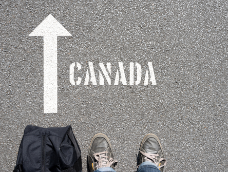 A man with a travel bag on his way to Canada
