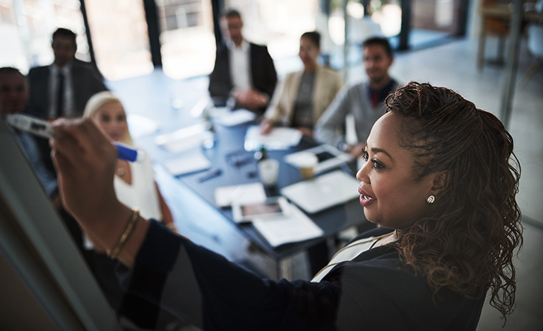 Woman leading a boardroom discussion