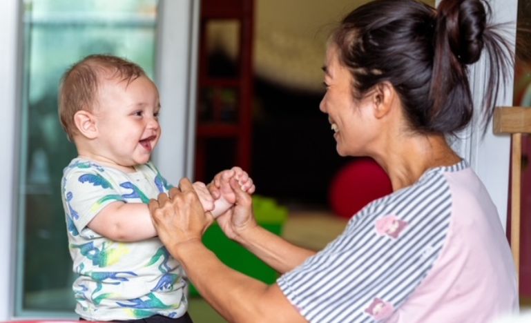A caregiver interacts with a child