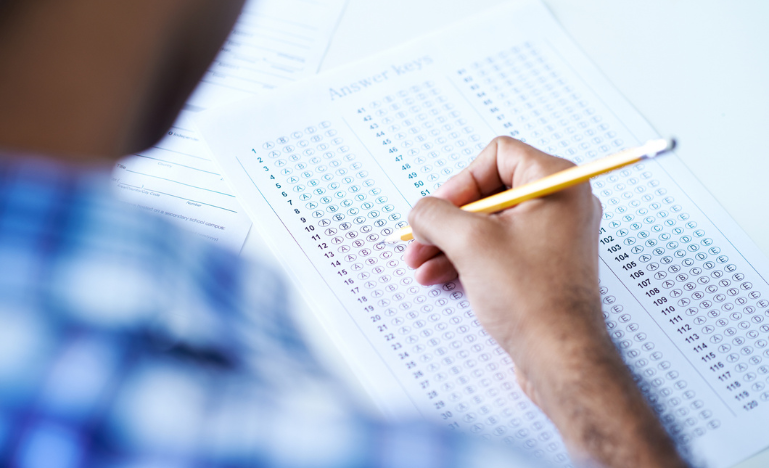 A student fills out a bar exam answer sheet