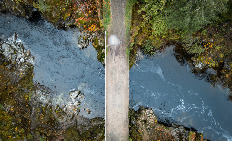 Aerial view of a rural logging road over a river on Vancouver Island