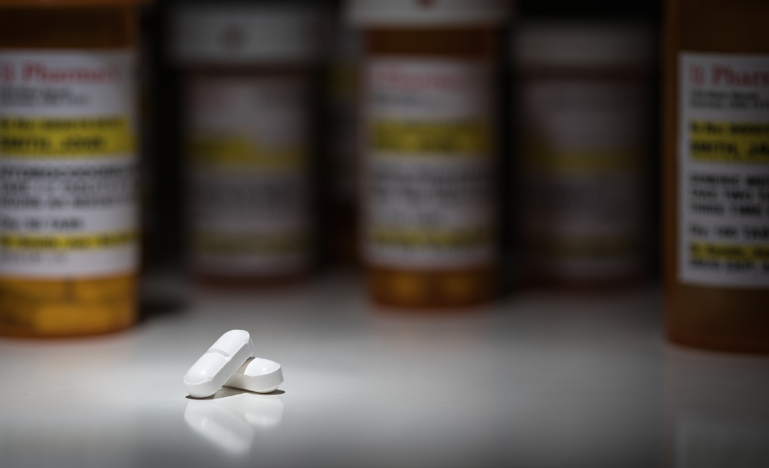 Hydrocodone pills and prescription bottles