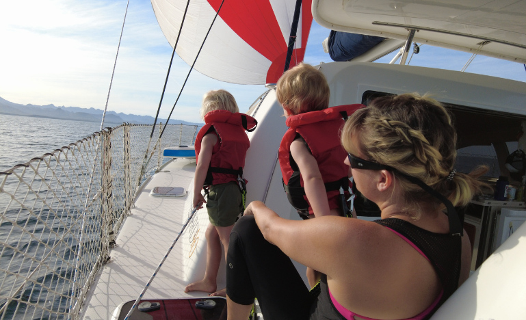 Erin Easingwood and her daughters while under sail