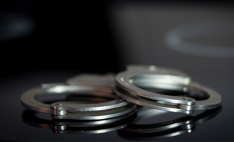 Handcuffs on dark background